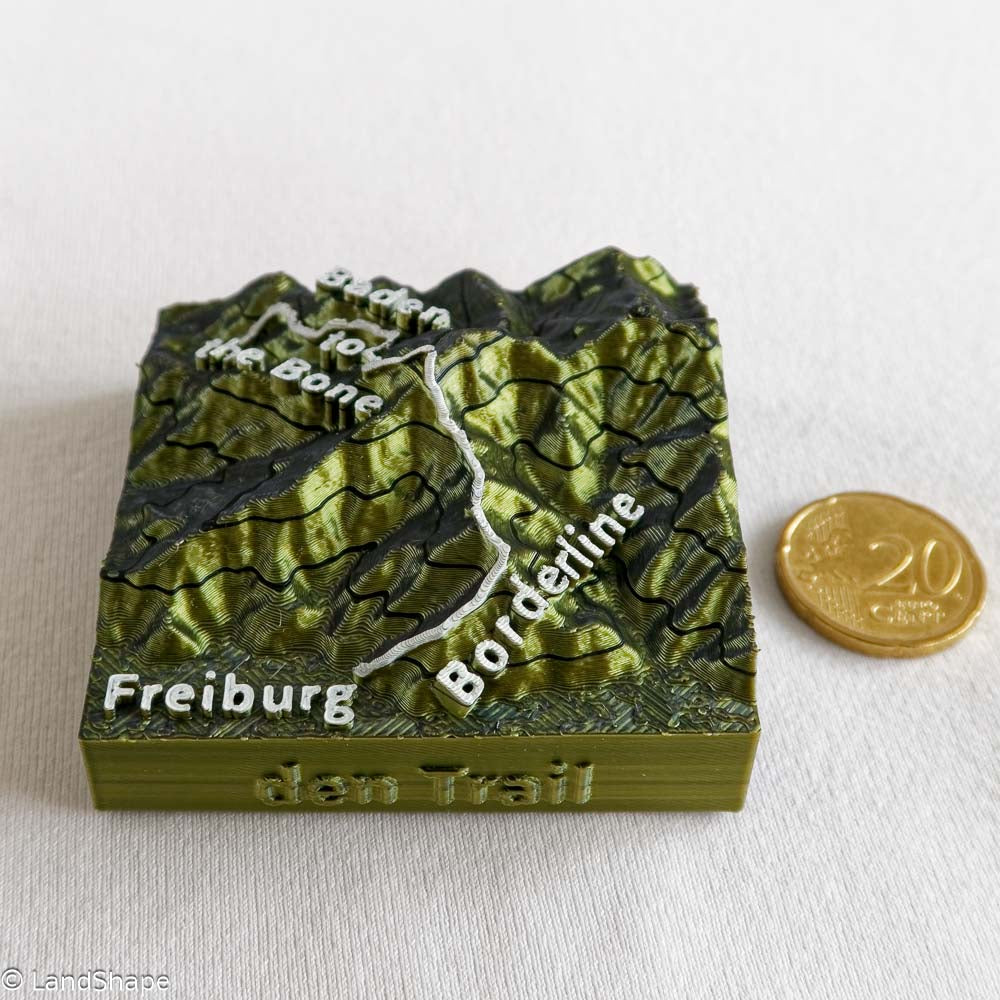 Produktfoto des Borderline-Trail Dekomagneten in Moss Metallic mit 20 Cent Münze